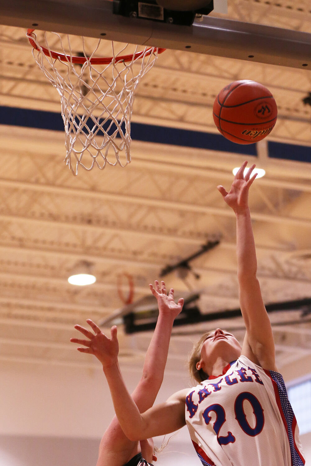 Tinley Pierson jumps for a layup against Hulett freshman Myah Cornett